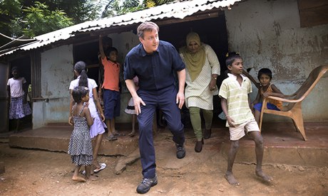 David Cameron meets Tamil refugees in the Sabapathy Pillai refugee camp in Jaffna, northern Sri Lanka. Photograph: Stefan Rousseau/PA