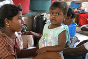A young girl and her mother at a displaced persons camp in Vavuniya, Sri Lanka (2009)